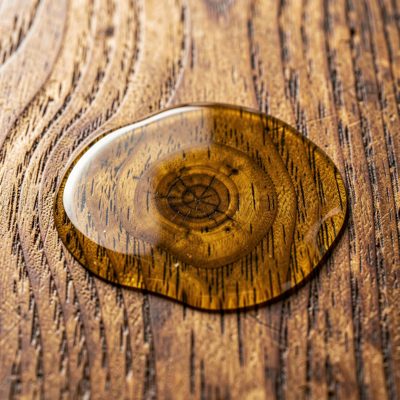 a wood grain photographed close with oil applied