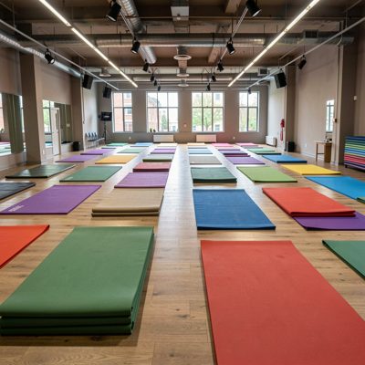 a studio with mats laid out in rows