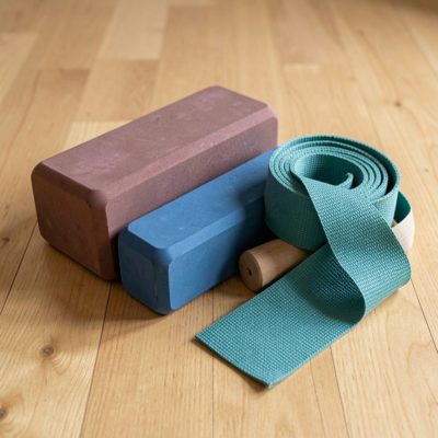 a set of yoga blocks and a strap