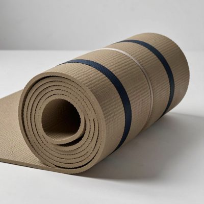 a yoga mat rolled with a strap around it